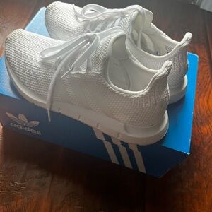 Women adidas sneaker size 5.5 color white worn once.